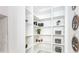 Bright walk-in pantry with ample shelving at 11042 Carnegie Ave, Englewood, FL 34224