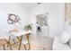 Home office with a view into the kitchen, offering an open floor plan at 11042 Carnegie Ave, Englewood, FL 34224