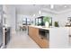 Modern kitchen with stainless steel appliances and large island at 11042 Carnegie Ave, Englewood, FL 34224