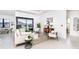Spacious living room featuring comfortable seating and large windows at 11042 Carnegie Ave, Englewood, FL 34224