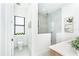 Modern bathroom featuring a toilet, walk-in shower, and vanity at 11042 Carnegie Ave, Englewood, FL 34224