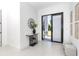 Light and airy entryway with contemporary decor and access to the backyard at 11042 Carnegie Ave, Englewood, FL 34224