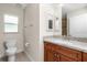 Simple bathroom with single vanity and toilet at 13020 Ridgely Cir, Port Charlotte, FL 33981