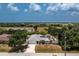 Aerial view of a single-story house with a fenced yard at 13020 Ridgely Cir, Port Charlotte, FL 33981