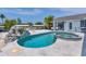 Inviting kidney-shaped pool with a spa, waterfall feature, and ample patio space at 245 Spaniards Rd, Placida, FL 33946