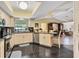 Kitchen features granite countertops, stainless steel appliances, and breakfast bar at 245 Spaniards Rd, Placida, FL 33946