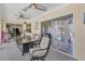 Spacious sunroom with tiled floors, seating area, and access to the outdoors at 245 Spaniards Rd, Placida, FL 33946