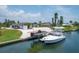 Covered boat dock with two boats and waterfront view at 245 Spaniards Rd, Placida, FL 33946