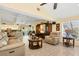 Spacious living room with vaulted ceilings, comfortable seating, and large TV at 245 Spaniards Rd, Placida, FL 33946