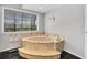 Relaxing bathroom with a large, built-in soaking tub and tiled flooring at 245 Spaniards Rd, Placida, FL 33946