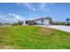 Outdoor storage shed with tractor and paddle boards at 245 Spaniards Rd, Placida, FL 33946