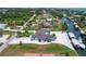 Aerial view of waterfront property with boat docks and a canal at 245 Spaniards Rd, Placida, FL 33946
