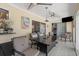 Relaxing sunroom with tiled floors, comfy seating, and ceiling fans at 245 Spaniards Rd, Placida, FL 33946