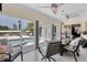 Sunroom with sliding doors offering stunning pool views at 245 Spaniards Rd, Placida, FL 33946