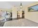 Open dining area with view into kitchen and living room at 245 Spaniards Rd, Placida, FL 33946