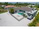 Aerial view of home with pool, RV, and fenced backyard at 245 Spaniards Rd, Placida, FL 33946