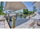 Private boat dock with covered slips and calm waters at 245 Spaniards Rd, Placida, FL 33946