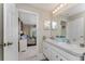 Bathroom with double vanity, and view of bedroom at 123 Antis Dr, Rotonda West, FL 33947