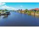 Peaceful canal view showcasing several homes with docks at 14091 Peekskill Ave, Port Charlotte, FL 33981