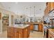Open concept kitchen with large island and walk-in pantry at 14091 Peekskill Ave, Port Charlotte, FL 33981