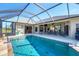 Spacious pool and patio with access from house interior at 14091 Peekskill Ave, Port Charlotte, FL 33981