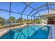 Relaxing screened pool and spa with access to interior at 14091 Peekskill Ave, Port Charlotte, FL 33981
