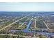 Expansive aerial view of community with homes and waterways at 14091 Peekskill Ave, Port Charlotte, FL 33981