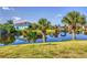 Peaceful view of canal with tropical landscaping at 14091 Peekskill Ave, Port Charlotte, FL 33981