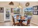 Breakfast nook with glass-top table and wicker chairs at 14091 Peekskill Ave, Port Charlotte, FL 33981