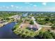 House located on a canal with lush landscaping at 14091 Peekskill Ave, Port Charlotte, FL 33981