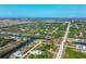 Aerial view of neighborhood with waterways and various homes at 14091 Peekskill Ave, Port Charlotte, FL 33981