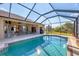 Enjoy this large screened pool with outdoor dining area at 14091 Peekskill Ave, Port Charlotte, FL 33981