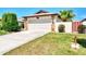 Single-story home with attached garage and landscaped yard at 570 Foxwood Blvd # 196, Englewood, FL 34223