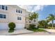 Two-story townhome with attached garage and lush landscaping at 10309 Coral Landings Ct # 101, Placida, FL 33946