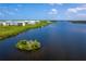 Waterfront property with community homes and lush landscape at 10309 Coral Landings Ct # 101, Placida, FL 33946