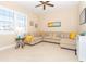 Relaxing living room featuring a sectional sofa and large window at 10309 Coral Landings Ct # 101, Placida, FL 33946