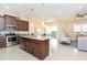 Open kitchen with island and stainless steel appliances at 10309 Coral Landings Ct # 101, Placida, FL 33946