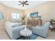 Spacious living room with large windows and comfy seating at 10309 Coral Landings Ct # 101, Placida, FL 33946