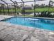 Inviting, refreshing pool with screened enclosure at 48 Long Meadow Ln, Rotonda West, FL 33947