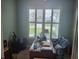 Home office with built-in desk and large window at 48 Long Meadow Ln, Rotonda West, FL 33947