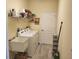 Laundry room with washer, dryer, and extra storage space at 48 Long Meadow Ln, Rotonda West, FL 33947