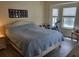 Main bedroom with large bed, windows, and access to backyard at 48 Long Meadow Ln, Rotonda West, FL 33947