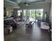 Spacious living room with large windows and view of pool at 48 Long Meadow Ln, Rotonda West, FL 33947