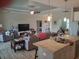 Open concept kitchen with granite countertops and island at 48 Long Meadow Ln, Rotonda West, FL 33947