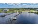 Aerial view of waterfront property with private boat dock at 14234 River Beach Dr, Port Charlotte, FL 33953