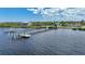 Aerial view of waterfront property with expansive backyard, large home, and private dock at 14234 River Beach Dr, Port Charlotte, FL 33953