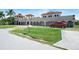 One-story home with unique architectural design, copper roof, and expansive lawn at 14234 River Beach Dr, Port Charlotte, FL 33953