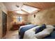 Guest bedroom with stone walls, tiled floors, and unique decor at 14234 River Beach Dr, Port Charlotte, FL 33953