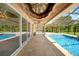 Covered patio with pool and spa, offering shade and relaxation at 14234 River Beach Dr, Port Charlotte, FL 33953