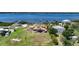 Aerial view of waterfront property with expansive backyard, large home, and private dock at 14234 River Beach Dr, Port Charlotte, FL 33953